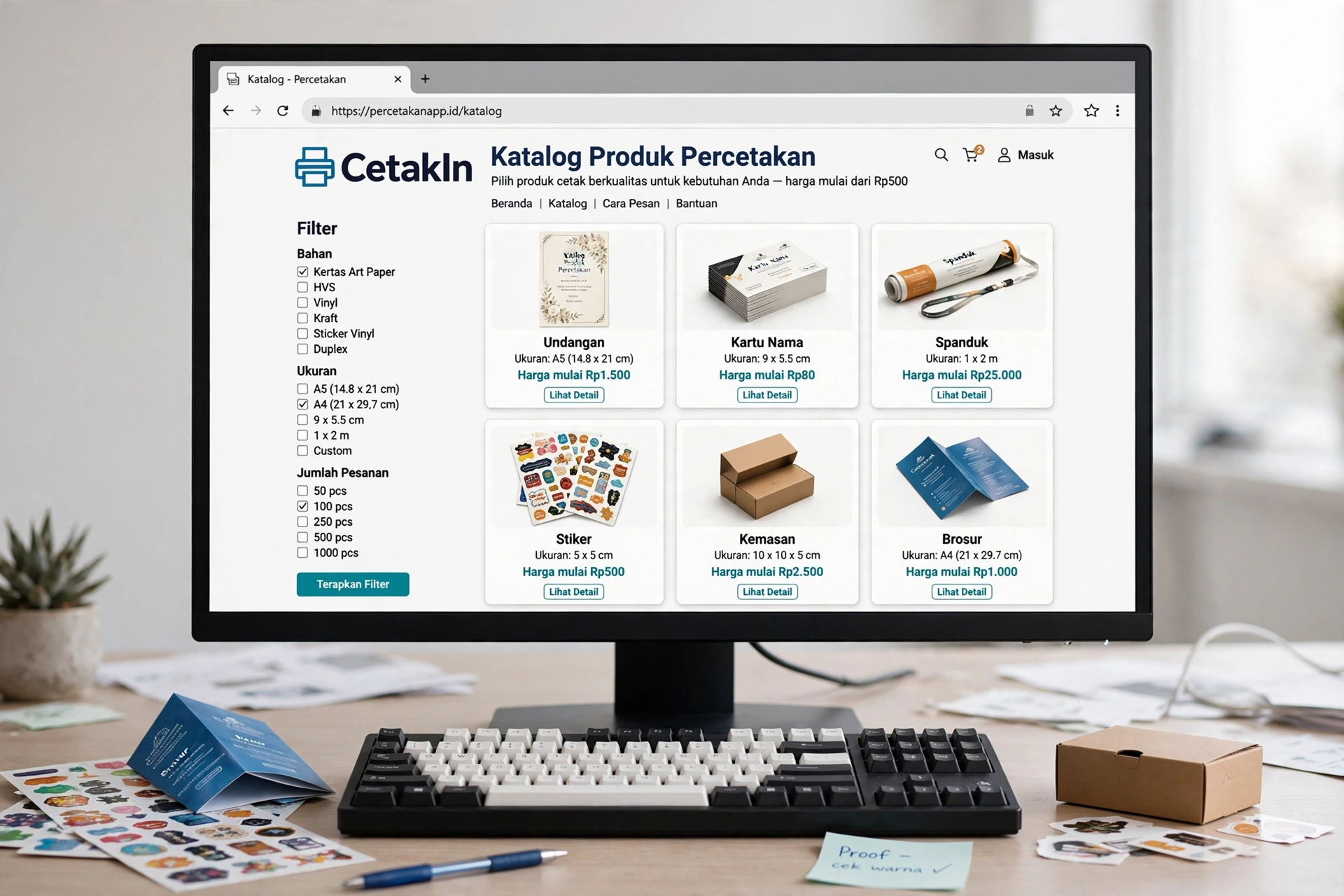 Katalog produk pada website percetakan menampilkan undangan, kartu nama, spanduk, dan stiker dengan harga mulai
